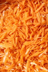 grated carrots vegetables salad as background