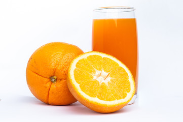 Orange juice glass  and oranges
