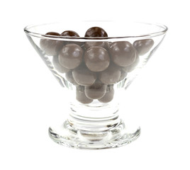 Milk chocolate balls in glass