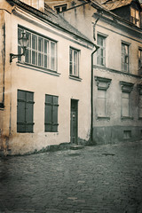 Fototapeta na wymiar Vintage style photo of old European town street