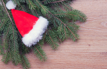 Santa's hat hanging on fir branches