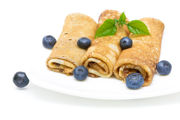 pancakes and blueberries on a white background