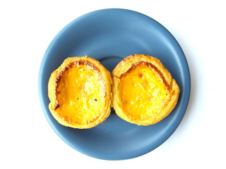 Egg tart isolated on white background with blue dish