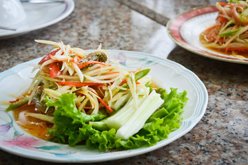 Thai spicy papaya salad with blue swimming crab