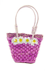 Fototapeta na wymiar A fiolet hand bag with daizy`s on it