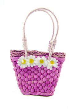 A fiolet hand bag with daizy`s on it