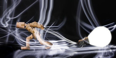 Box man dragging a light bulb