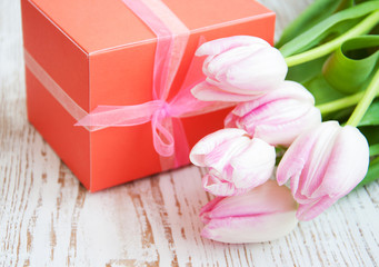 bouquet of  tulips, gift box on a table
