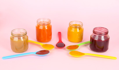 Baby puree on pink background
