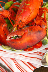 Red lobster on platter on table close-up