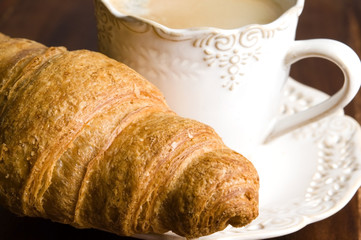 breakfast with cup of black coffee and croissants