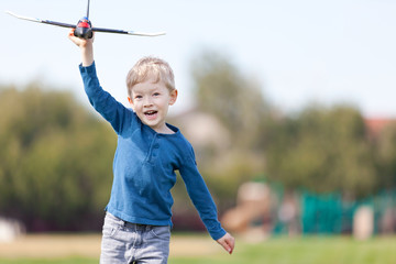 child playing with a plane