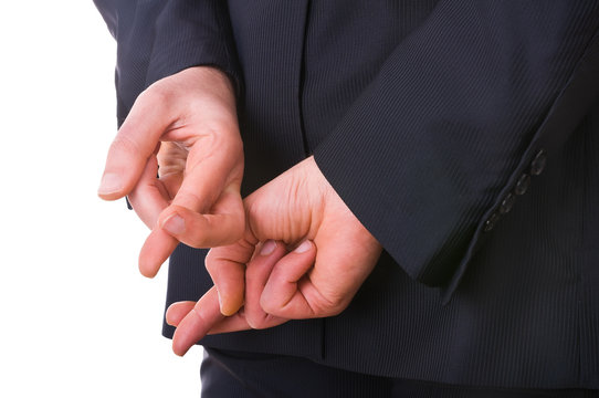 Business man with fingers crossed. - Powered by Adobe