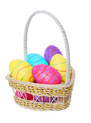 easter eggs, colorful painted eggs in basket isolated