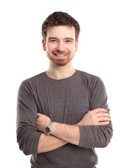 Casual young man looking at camera with arms crossed