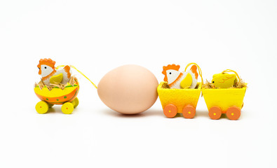 A chicken towing an egg with his family