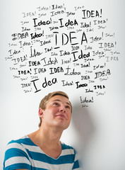 Idea concept. Young man with idea signs overhead