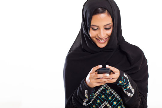modern Arabic woman playing on smart phone