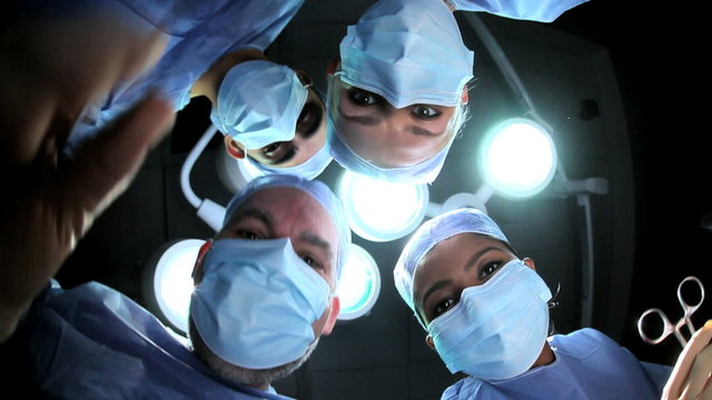 Multi Ethnic Surgical Team in Operating Theater Patient POV