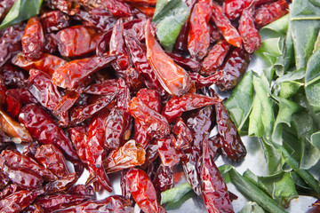 Red chilli and kaffir lime leaves, fried .