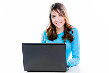 smart and beautiful girl working on a laptop