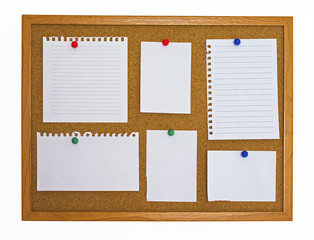Multiple type of note papers pinned on cork board - 50488411
