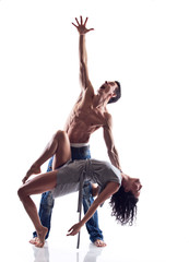 Muscular dancer expressing emotions while holding his partner - 50489021