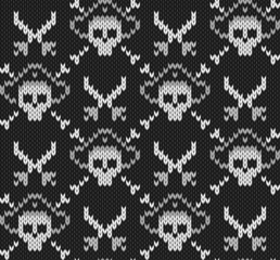 Knitted background with skulls