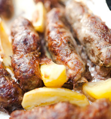 Grilled sausage served with potato