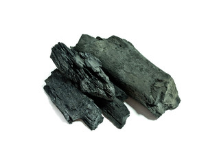 Lumps of charcoal on white  background