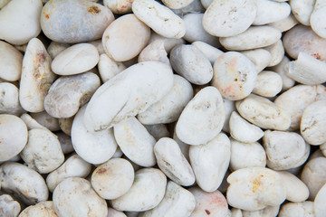 Fototapeta na wymiar Texture of white stones on the sea coast, outdoor