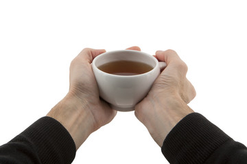 man's hands holding cup of tea