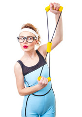 Funny woman with expander, fitness girl over white background
