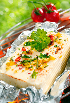 Halloumi cheese grilling in tin foil