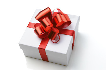 Gift white box with red ribbon on white background