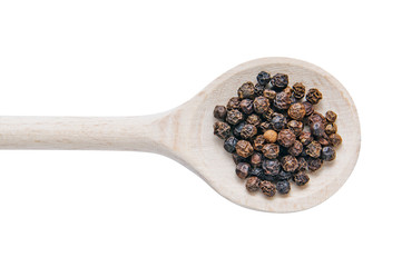 Pepper on wooden spoon on white background