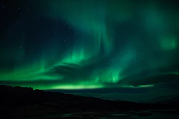 Fotobehang Northern lights above lagoon in Iceland © jamenpercy