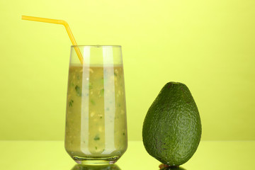 Useful fresh avocado on green background