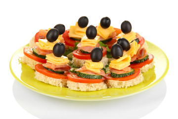 Canapes on plate isolated on white