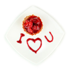 Sweet cake with strawberry and sauce on plate, isolated on