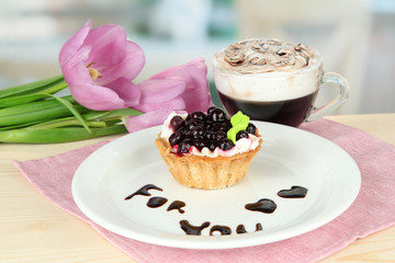 Sweet cake with blackberry and chocolate sauce