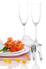 Festive table setting with flowers isolated on white