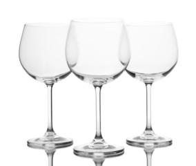 Empty wine glasses arranged and isolated on white