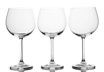 Empty wine glasses arranged and isolated on white