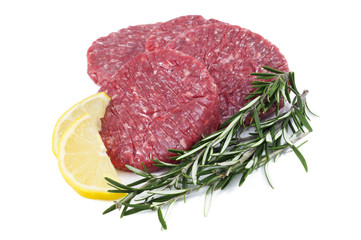 raw hamburgers with protective film