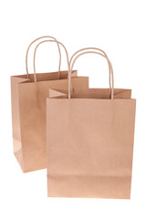 Two brown paper shopping bags isolated on white