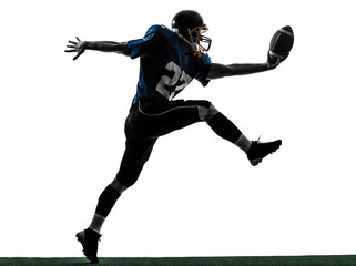 Fototapeta na wymiar american football player man scoring touchdown silhouette