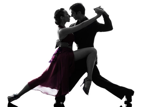 couple man woman ballroom dancers tangoing  silhouette