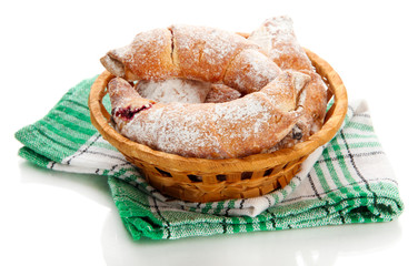 Taste croissants in basket isolated on white.
