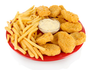 Fried chicken nuggets with french fries and sauce isolated